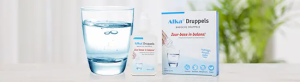 Alka Druppels in een glas met water